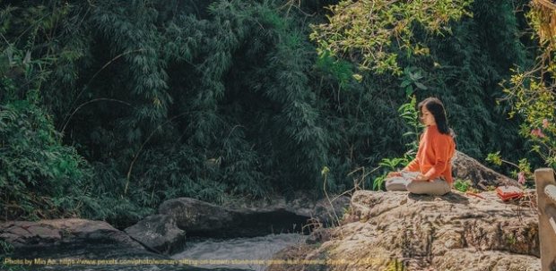 Photo by Min An, https://www.pexels.com/photo/woman-sitting-on-brown-stone-near-green-leaf-trees-at-daytime-1234035/